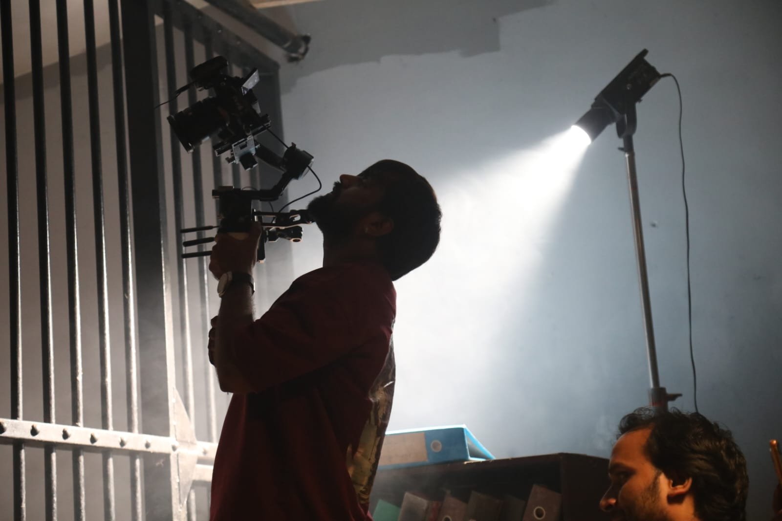 Crew and actress reviewing a shot on set during a DR Infinity production